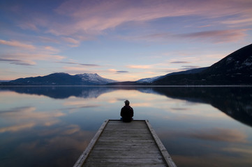 Taking in the sunset colours over Shuswap Lake in Sunnybrae, near Salmon Arm, British Columbia, Canada. MR102