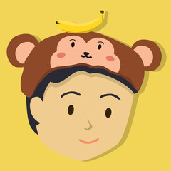 Face of a boy with monkey hat on yellow background.