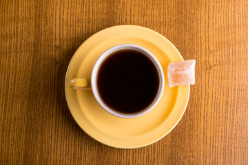 Yellow coffee cup shot from above