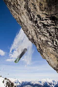 A male skier airs a cliff while on a cat ski trip, Monashees,  Vernon, Britsh Columbia, Canada