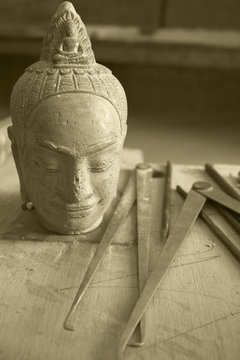 A carved Buddha head at Artisans Angkor, Siem Reap, Cambodia.