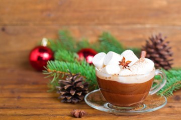 cup of hot cocoa with marshmallows on a Christmas background