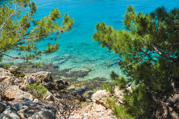 Fototapeta na wymiar Mediterranean sea coast with clear sea water at Kastelorizo island on sunny day, Dodecanese, Greece
