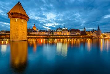 Night view towards Chapel Bridge (Kapellbruecke) together with the octagonal tall tower...