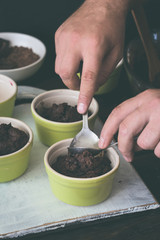 Man making a chocolate dessert in the kitchen