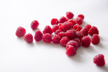 Fresh raspberries, white background