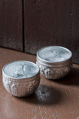 two glass of water serve in traditional thai silver bowl