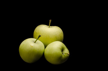 Green apples with black background