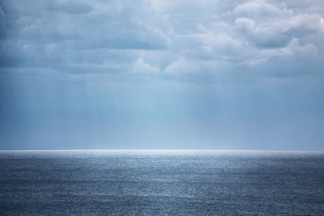 Beautiful seascape of blue sea and sky with clouds