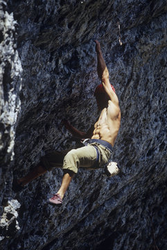 Man climbing an 11c at Grassi Lakes, Alberta, Canada.