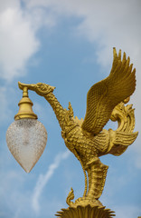 Golden swan statue,  traditionnal  lamp , Thailand.