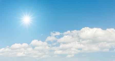 Fototapeta na wymiar Blue sky with clouds and sun reflection