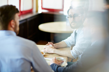 Businessmen at cafe