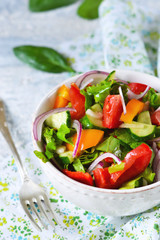Vegetable salad with spinach, tomato and cucumber 