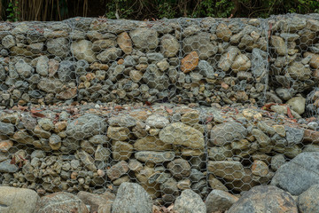 Gabion wall made of stone and steel mesh