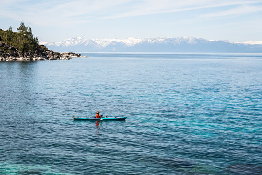 Man fishing from kayak at Lake Tahoe
