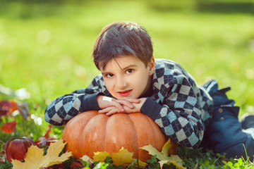 Boy Playing With Pumpkin