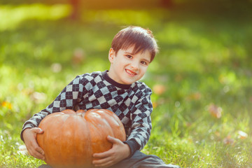 Boy Playing With Pumpkin