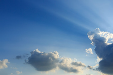 Fototapeta na wymiar light rays explosion on clear blue sky with cloud