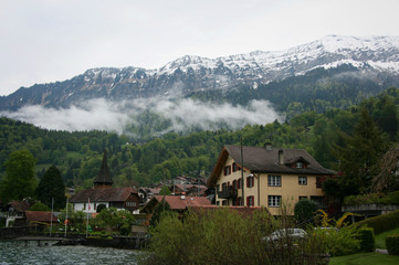 Fototapeta na wymiar Fog rising and amazing mountain scenery at Interlaken, Switzerland