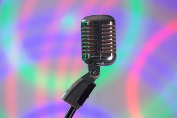 Fototapeta na wymiar Music microphone for singing on a colored background 
