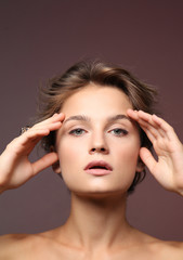 Fototapeta premium Portrait of beautiful young woman on color background