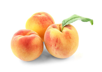 Naklejka na ściany i meble Juicy ripe peaches isolated on white