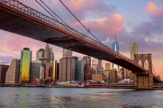 Sunrise colors of Brooklyn Bridge and Manhattan in New York City