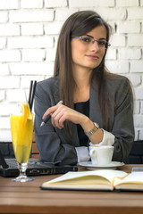 Portrait Of Successful Businesswoman Working At Cafè