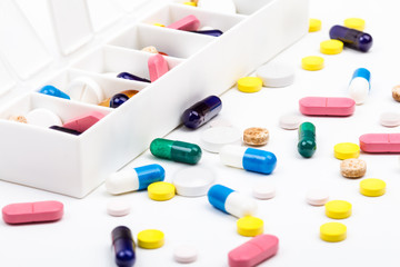 Pills and capsules in and out of pill organizer
