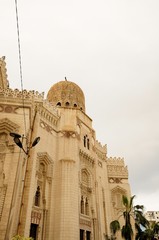 Tower minaret against a bright blue sky, Alexandria, Egypt