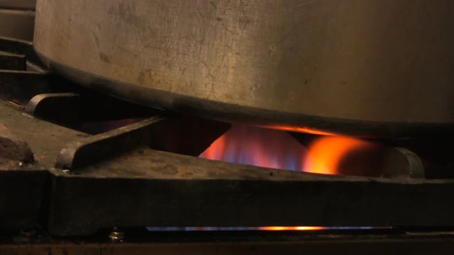 A large pot over an industiral gas burner. HD 1080p.