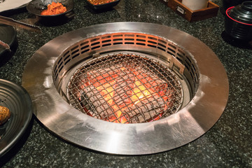 Empty And Clean Barbecue Charcoal Grill With Flames Of Fire
