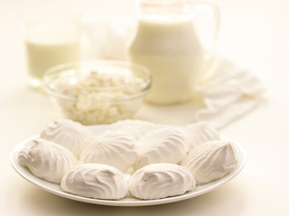 the glass of fresh milk and curd desserts on a light background