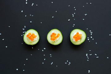 appetizer. Cucumber with caviar and cream cheese on the bamboo mat