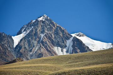 Fototapeta premium Mountain, cliffs, glaciers and snowfields in the Tien Shan