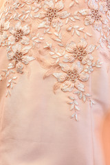 Beautiful lace with flower pattern - macro photo on wedding dres
