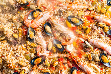 Preparing Paella rice and fish