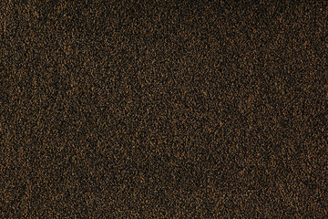Brown monotone grain texture. Dark sand background.