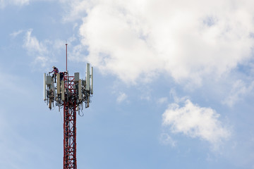 maintenance work repeater telecommunication tower with blue sky