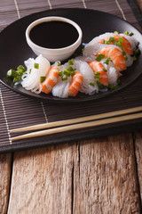 Japanese food: Shirataki with prawns, spring onions and soy sauce close-up. Vertical
