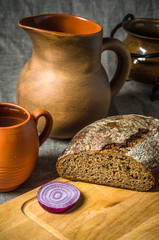 Still life with homemade bread and pottery
