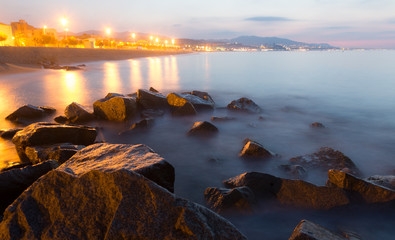 Fototapeta na wymiar Stones at beach in morning time. Badalona