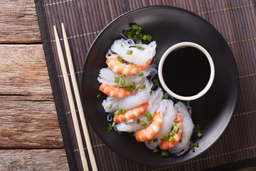 Shirataki with prawns, chives and soy sauce. Horizontal top view 

