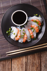 Shirataki with prawns, chives and soy sauce. vertical top view 
