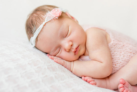 Sweet Face Of A Newborn Girl
