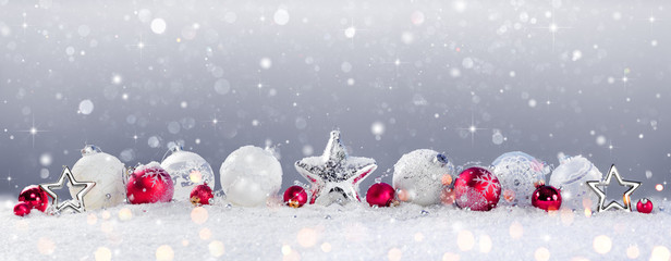 Christmas Baubles Decoration And Snowfall On Snow

