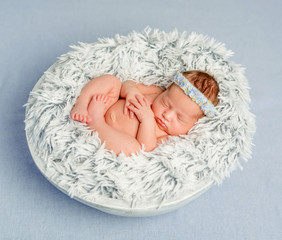 funny newborn girl with headband