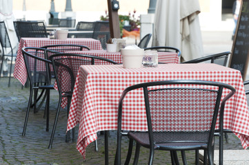 tables of street cafe in the Italian city