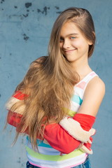 Fashionable teen girl with long hair and a red jacket. Teenage Autumn Fashion
